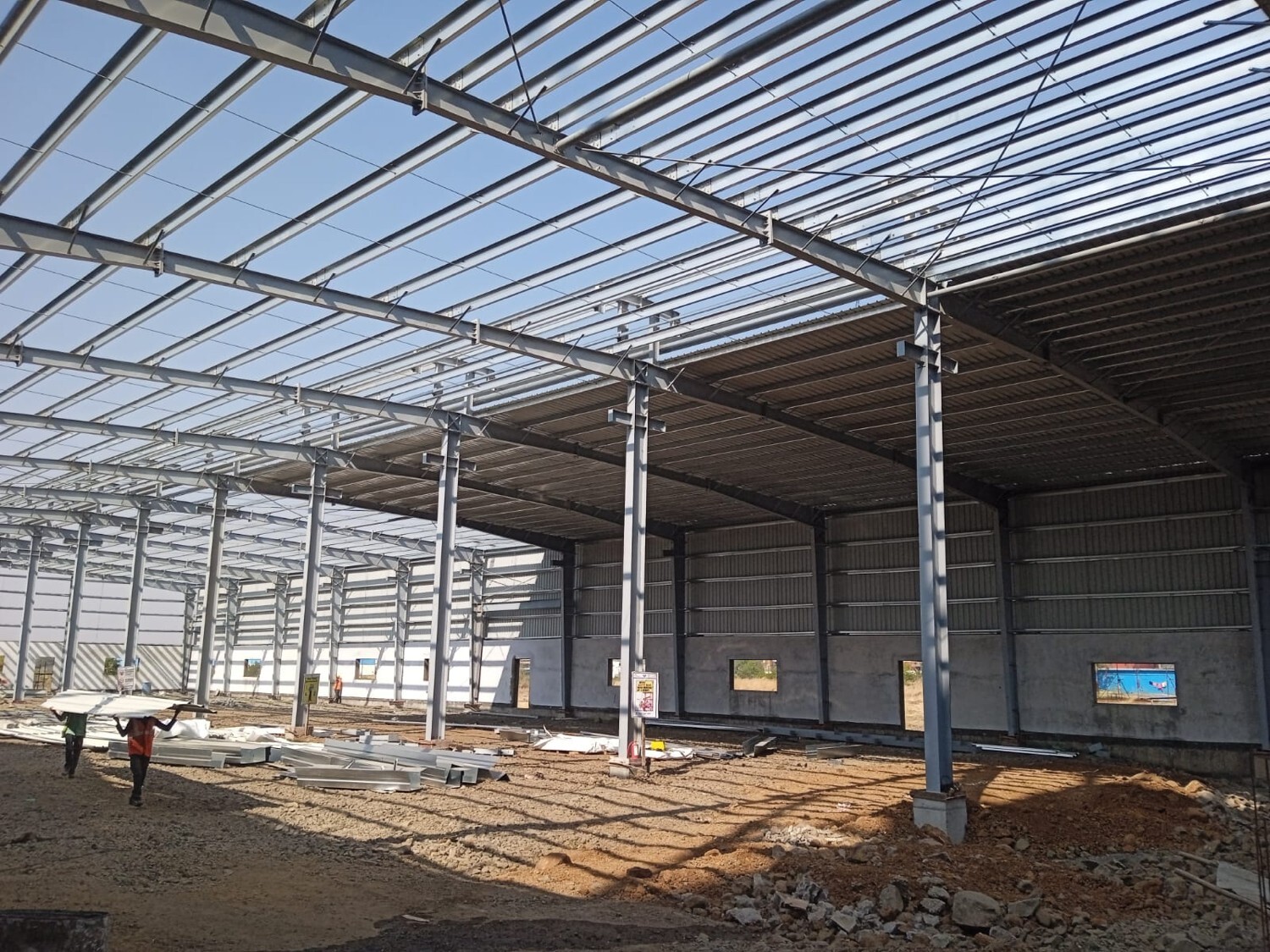Commercial architectural roofing at Oberoi Mall, Mumbai: Specialized Kliplok roof-on-roof installation by Rishonn & Reyansh for leak-proof retail infrastructure.